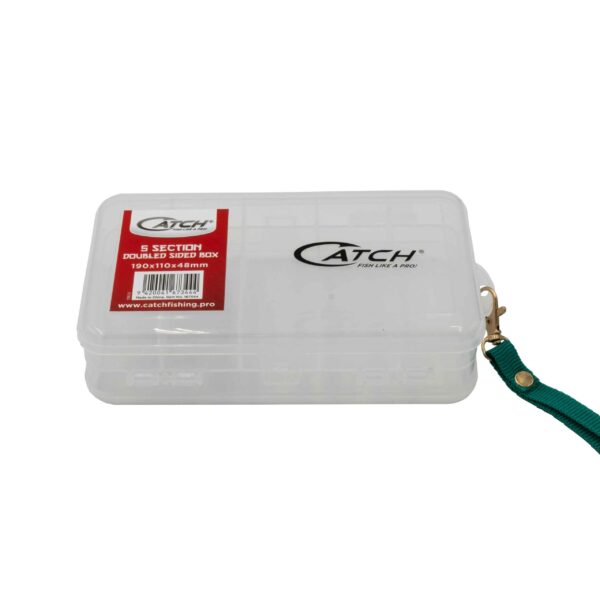 Check out this sleek transparent tackle box that’s all about efficiency and style! With its eye-catching green wrist strap, you'll never lose sight of it. Featuring the standout "Catch" logo, this is not just any tackle box – it’s the "Catch Tacklebox 5 Section Doublesided." Perfectly sized at 190 x 110 x 48 mm, it’s designed for those who demand durability with a touch of class. Ready to elevate your fishing gear? Dive into organized bliss with this must-have companion!.