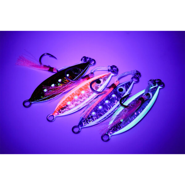 Against a sleek, dark backdrop, the Catch Baby Boss Jigs shine like hidden treasures. These four metallic fishing lures aren't just any ordinary hooks; they illuminate with vibrant purple, blue, and orange hues under ultraviolet light. Perfect for lighting up your fishing game!.