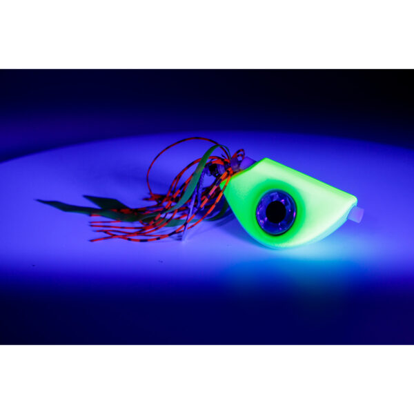 Introducing the Catch Beady Eye Kabura Jig in striking luminous green! This beauty features a circular eye surrounded by vibrant strands, perfectly contrasted against a dark blue backdrop. Whether you're on the hunt for your next big catch or just want to try something new, this jig is designed to stand out and deliver results.