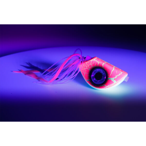 Check out the Catch Beady Eye Kabura Jig in fluorescent pink—a real head-turner! With its feathered strands, this bad boy lights up like a neon dream under blue and purple light, set against a crisp white backdrop. Perfect for when you want to add some serious pop to your fishing gear lineup!.