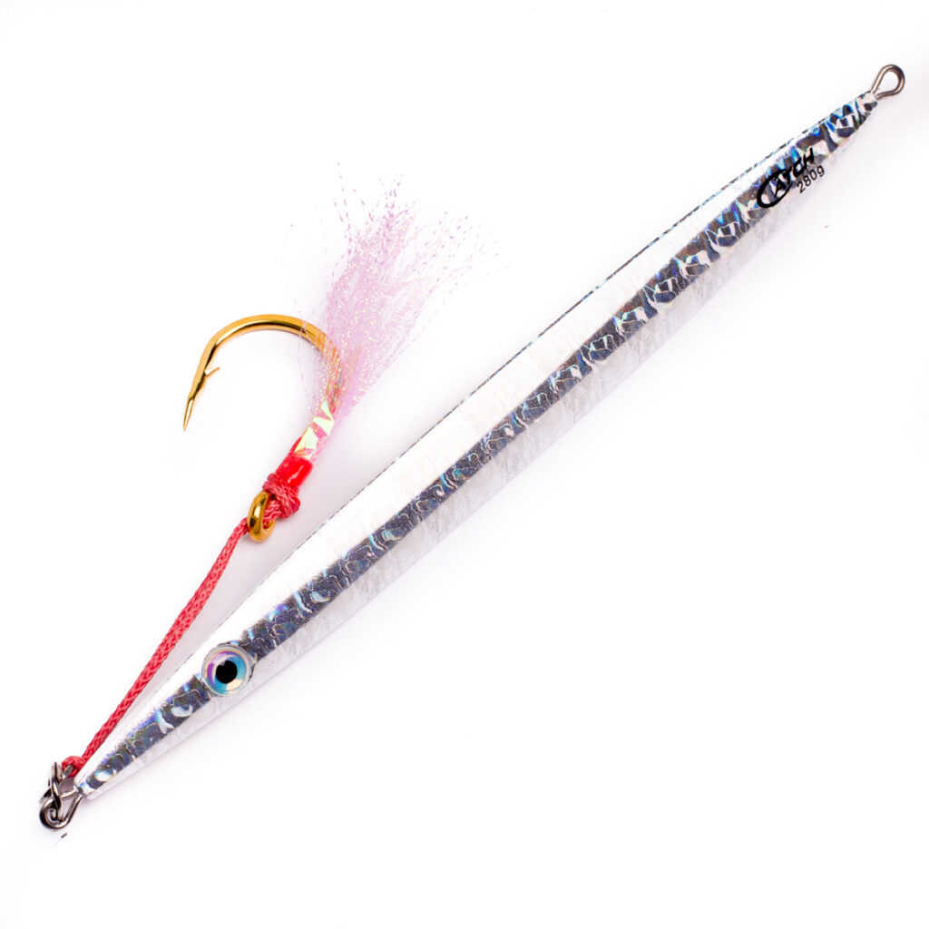 Hook into the action with The Catch Deep-V Slowpitch Jig, where precision meets style. This bad boy sports a slick, elongated metallic body complete with a textured finish that screams finesse. Decked out with a single gold hook, it's locked and loaded using vibrant red thread and popping pink fibers. Fish won't know what hit 'em!.