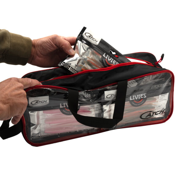 With the precision of a pro angler, you're stacking those fishing lures into our sleek black and red transparent Catch Softbait Storage Bag. You're making use of every inch like a seasoned tackle master, all while clutching that prized package of "Livies" lures. It's organization at its finest and functionality in style, ready for the next big catch!.
